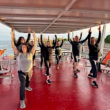 Boat yoga offered by one of the guests (photo by Laurie A.)