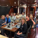 One of many yummy meals with our cruise mates. (photo by Cherie S.)