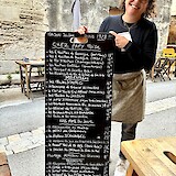 Friendly service while selecting a tasty meal at a fish restaurant in Aigues-Mortes. (photo by Robert Y.)