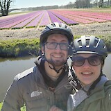 My husband and I near flower fields in the Keukenhof. (photo by Giovana P.)