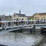 Our biking group crossing a bridge in Alkmaar Overstad on April 22, 2025 (photo by Debra & Terry B.)