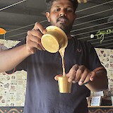 Rahul serving masala chai (photo by MaryAnn L.)