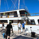 Unloading the bikes..a daily ritual for the crew (photo by Bob R.)