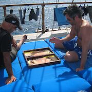 Board game on the sundeck | Panagiota | Bike & Boat Tour