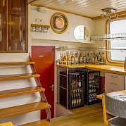 Bar area in the dining room aboard the Allure | Bike & Boat Tours