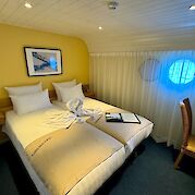 Double bed setting aboard the Merlijn - Bike & Boat Tours