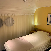 Twin bed setting aboard the Merlijn - Bike & Boat Tours