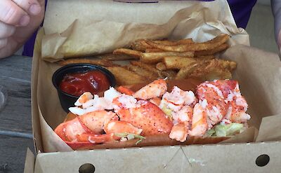 Maine lobster roll, of course! Flickr:Maine Foodie Tours