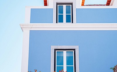Blue and white building, Cascais, Portugal. Unsplash@Lukas Souza