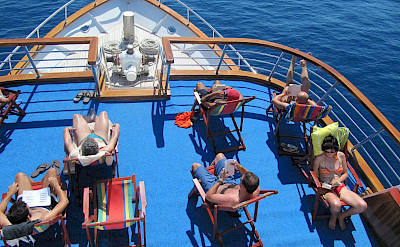 Sunning and relaxing on the Romantica | Bike & Boat Tours