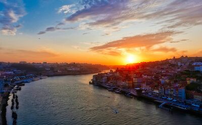 Sunset over Porto, Portugal. Unsplash:Junpeng Ouyang