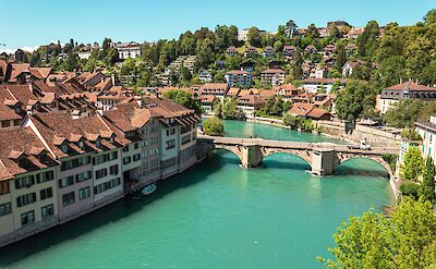 Aerial view of the turquoise Aare River flowing through Bern, Switzerland. Unsplash@Mads Egmose