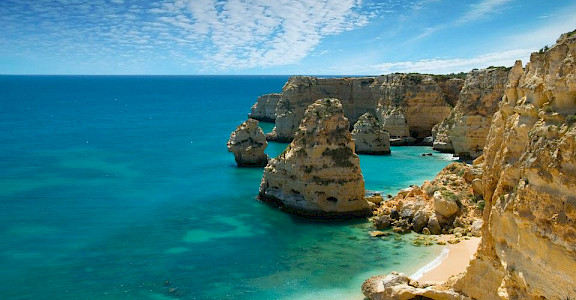 Cliffs of Lagos, Algarve, Portugal. Photo via Wikimedia Commons:Ricard12