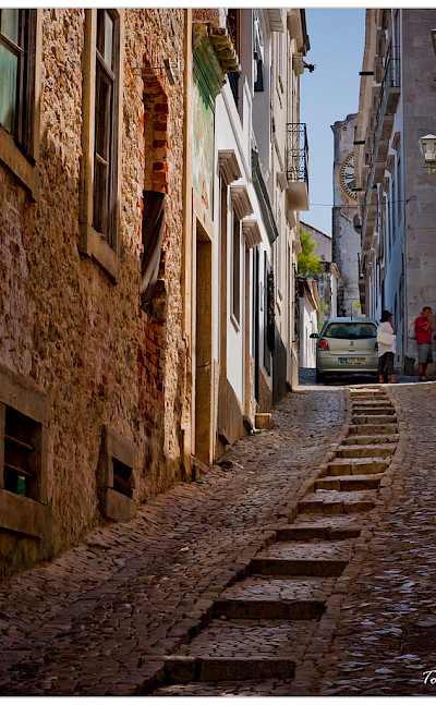 Road less traveled in Tavira, Algarve, Portugal. Photo via Flickr:Tolbxela