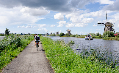 Windmills and bike paths make up Kinderdijk, South Holland, the Netherlands. Photo via Flickr:Luca Casartelli