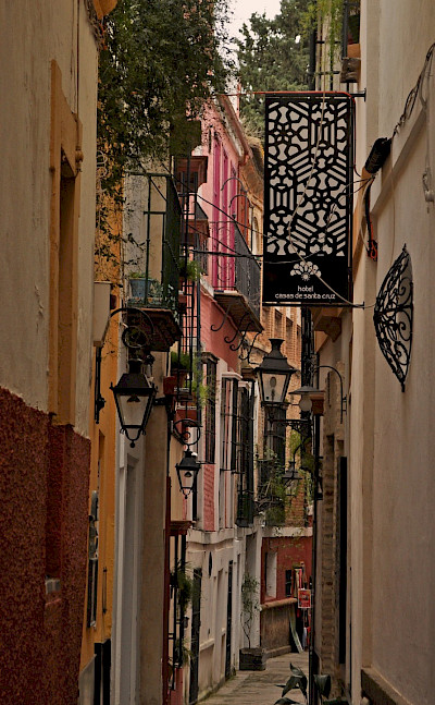 Narrow streets in Seville, Spain. Flickr:Harshil Shah