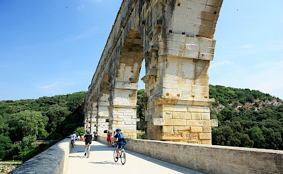 Biking along Pont du Gard, the famous Roman aqueduct in Provence, France. Flickr:Andrea Schaffer