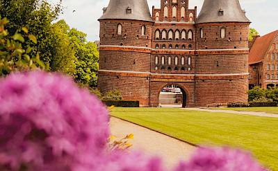 Holstentor is a old city gate into Lübeck, Germany, the ancient Hanseatic Town. Photo by Julia Solonina on Unsplash