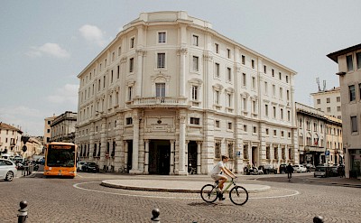 Cycling in the streets of Mantova, Italy. Unsplash@Rhamely