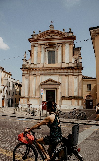 Cyclist in Bolzano, Italy. Unsplash@Rhamely