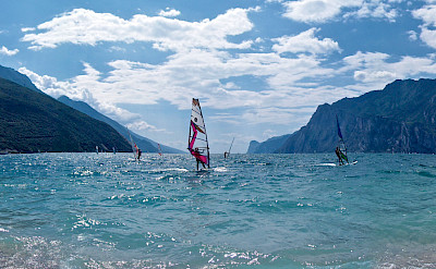 Windsurfers on Lake Garda, Italy. Photo via Flickr:Andrea Santoni 45.633333, 10.666667