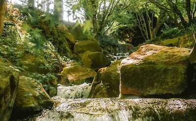 A small waterfall near Merano, Italy. Unsplash@Miraxh Tereziu