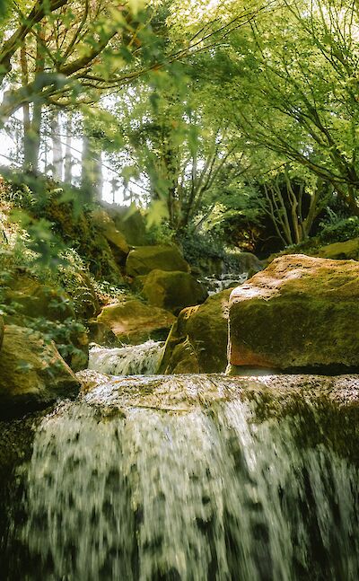 A small waterfall near Merano, Italy. Unsplash@Miraxh Tereziu
