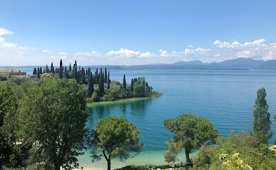 The sunny shoreline of Lake Garda, Italy. Unsplash@Marco Ghirello