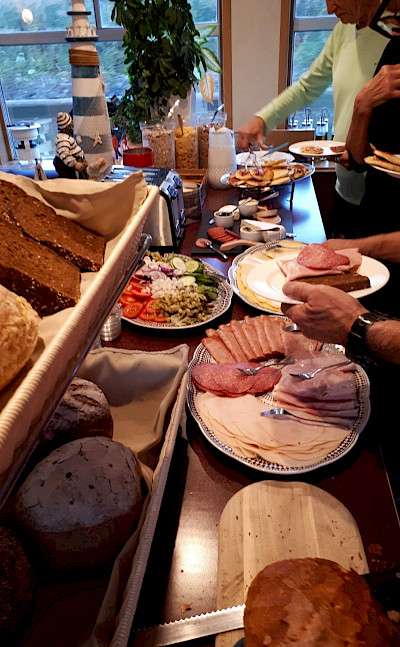 Breakfast spread on this Paris to Bruges tour through France and Belgium. Photo by Eric Darwin