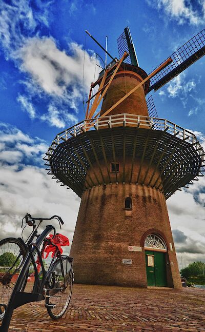 Bike rest at windmill in Rotterdam, South Holland, the Netherlands. Flickr:Luca Bolatti Guzzo 