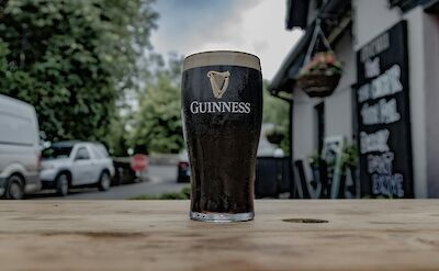 Fresh pint of Guinness in a traditional Irish pub!. unsplash:Michael Starkie