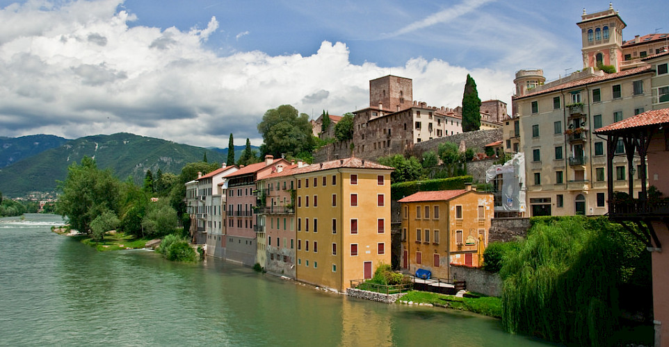 Biking through Bassano del Grappa, Italy. Photo via Flickr:Graeme Churchard 