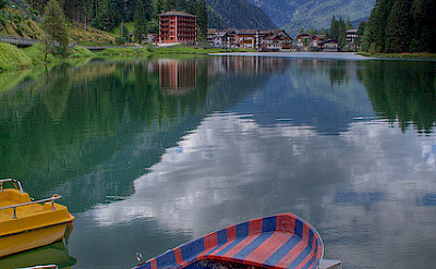 Lake Alleghe, Dolomiti Bellunesi National Park, Belluno, Veneto, Italy. Photo via Flickr:Roberto Ferrari