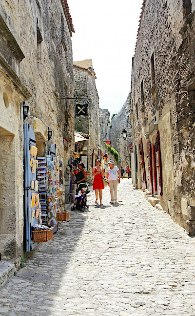 Shopping alley in Les Baux de Provence, France. Flickr:Andrea Schaffer