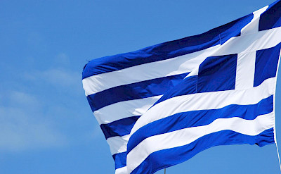 Greek flag flying in Athens, Greece. Flickr:Ana Raquel Shernandes