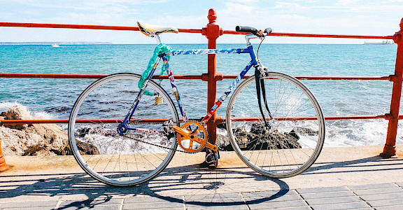 Biking along the beach in Mallorca, Spain. Flickr:Jörg Schubert
