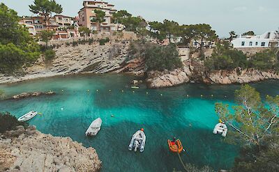 Boats in the sea on Mallorca, Spain. Unsplash@Eugene Zhyvchik