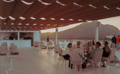 Restaurant at sunset in Alc&uacute;dia, Mallorca, Spain. Unsplash@Adam Tamasi