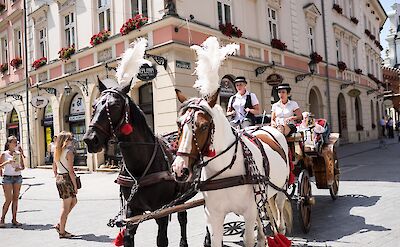 Horse-drawn carriage rides in Old Town, Kraków, Poland. Flickr:Davis Staedtler