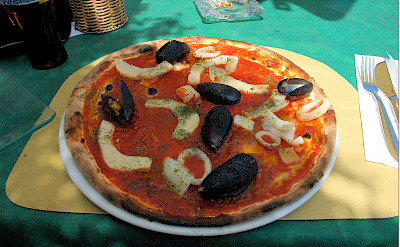 Seafood pizza in Peschiera del Grapa, Italy. Photo via Flickr:Janos Korom Dr