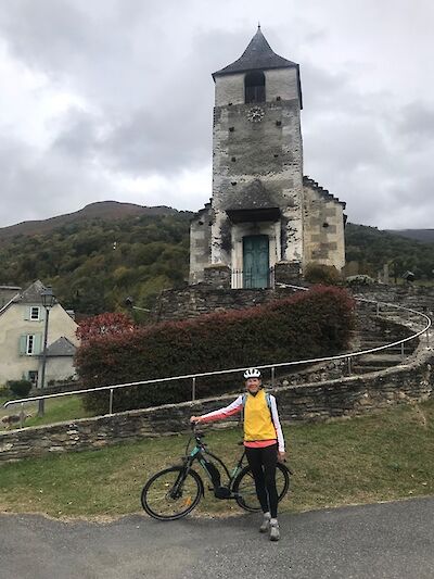 Hennie posing at the foot of the Pyrenees Mountains in France! We have many e-bike options in France.
