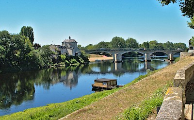 A peaceful riverside scene in Chinon. Unsplash@MartinSepion