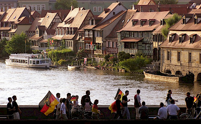 Football fans passing "Little Venice," Bamberg, Germany. Photo via Flickr:Alan Bruce