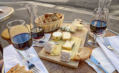 Wine, cheese and bread board in Paris, France. Flickr:Joe deSousa