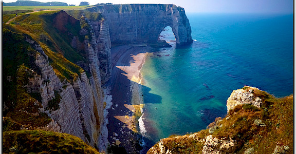 The famous Etretat cliffs in Normandy. Photo via Flickr:Moyan Brenn