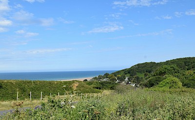 Road down to Omaha Beach, France. Unsplash@Lynn Van den Broeck