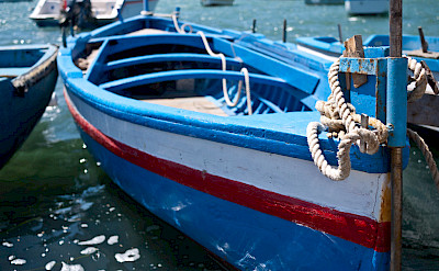 Boats docked in Marzamemi, Sicily, Italy. Photo via Flickr:sporkist