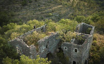 Castle ruins at Ardeche Gorge, France bike boat tours. Unsplash:baptx