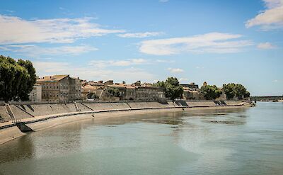 Houses along the river, Arles, France. Unsplash:Baptiste Buisson