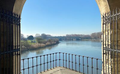 View of the river in Avignon, France bike boat tours. Unsplash:Elly Ch